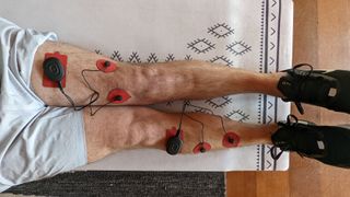 Therabody PowerDot 2.0 Duo attached to thigh and shin