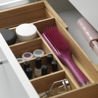 wooden divider in a drawer in a bathroom