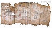 A tattered piece of bark paper with illustrations on it.