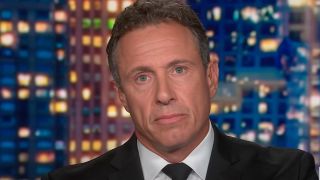 Chris Cuomo looks somber while talking about brother Andrew Cuomo on CNN. 