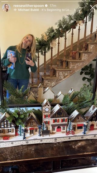 Reese Witherspoon posing in her holiday festive home.