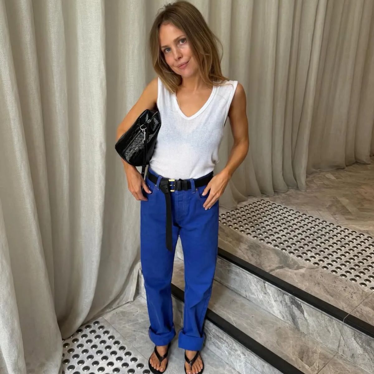 Influencer Rachelle Rowlings wearing a cobalt blue trousers