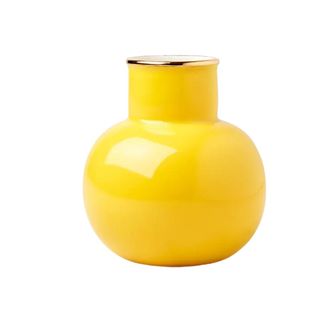 A yellow bud vase