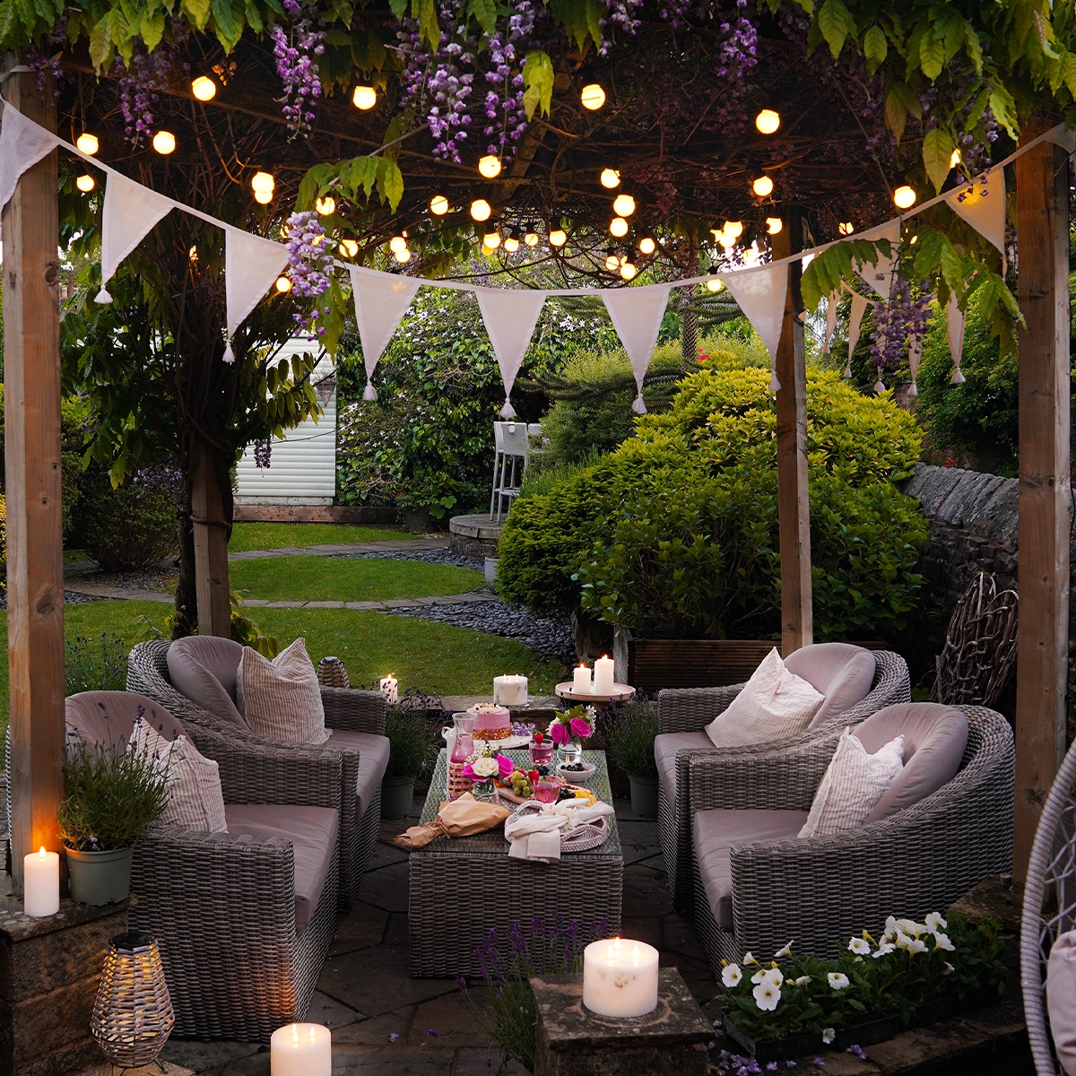 outdoor dining area with bunting and string lights