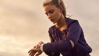 Woman checking sports watch