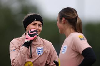 Hannah Hampton of England talks with teammate Mary Earps during a Training Session at the England Women June International Camp on July 01, 2024 in Noordwijk aan Zee, Netherlands.