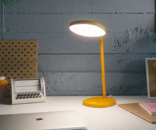 A Lumie Task SAD lamp illuminating a desk