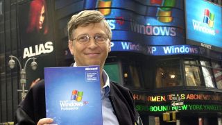 Bill Gates holding up a copy of Windows XP operating system in New York's Times Square.