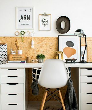 Creative home office set-up with motivational prints and washi tape hooks on wall, and cork notice board wall panel idea.