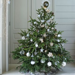 Decorated christmas tree with silver baubles