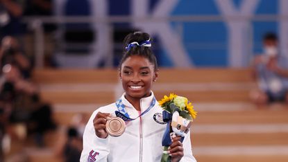 tokyo, japan august 03 simone biles of team united states poses with the bronze medal during the womens balance beam final medal ceremony on day eleven of the tokyo 2020 olympic games at ariake gymnastics centre on august 03, 2021 in tokyo, japan photo by jamie squiregetty images