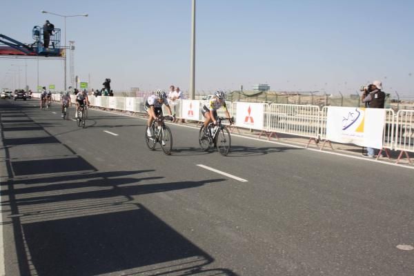 Ellen Van Dijk (HTC-Highroad) and Alexis Rhodes (Garmin-Cervelo) after crossing the finishing line in Lusail.