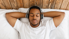 man sleeping with headphones on