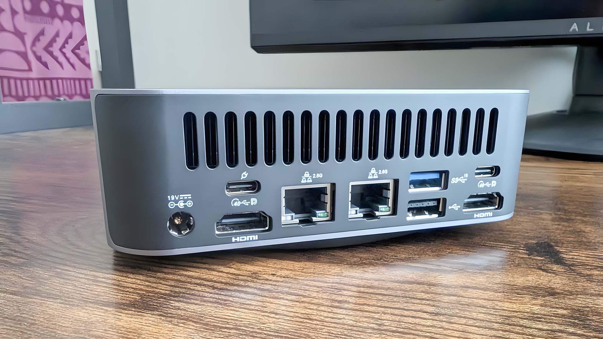 Close up of the Geekom GT1 Mega's back ports, which include two HDMI ports, two USB-C ports, two USB-A ports, and two RJ45 ports. 