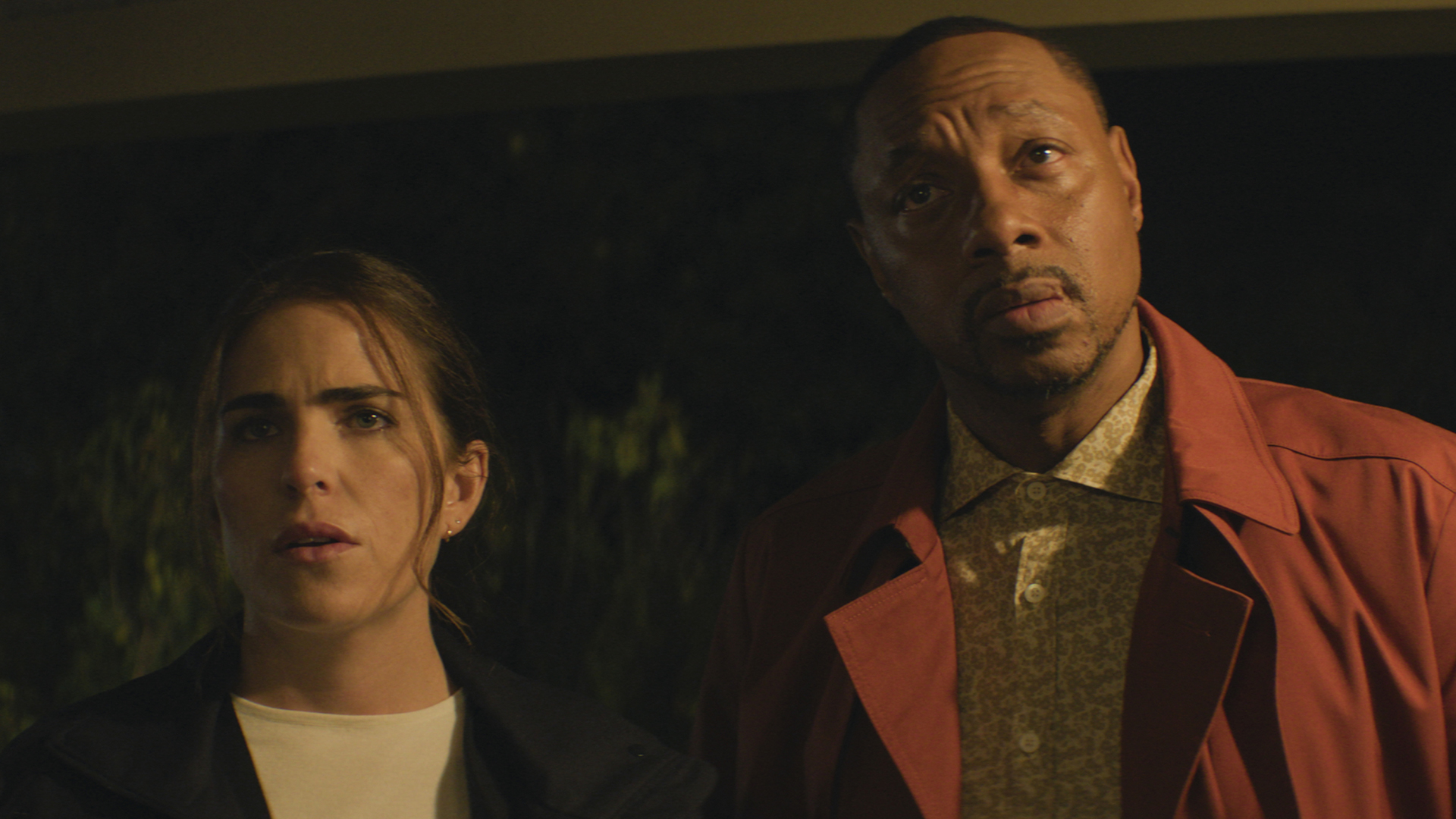 Lee and Karl staring at something that's off-camera in 56 Days