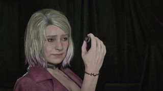 Maria holds up and examines one of the Silent Hill 2 Remake rings