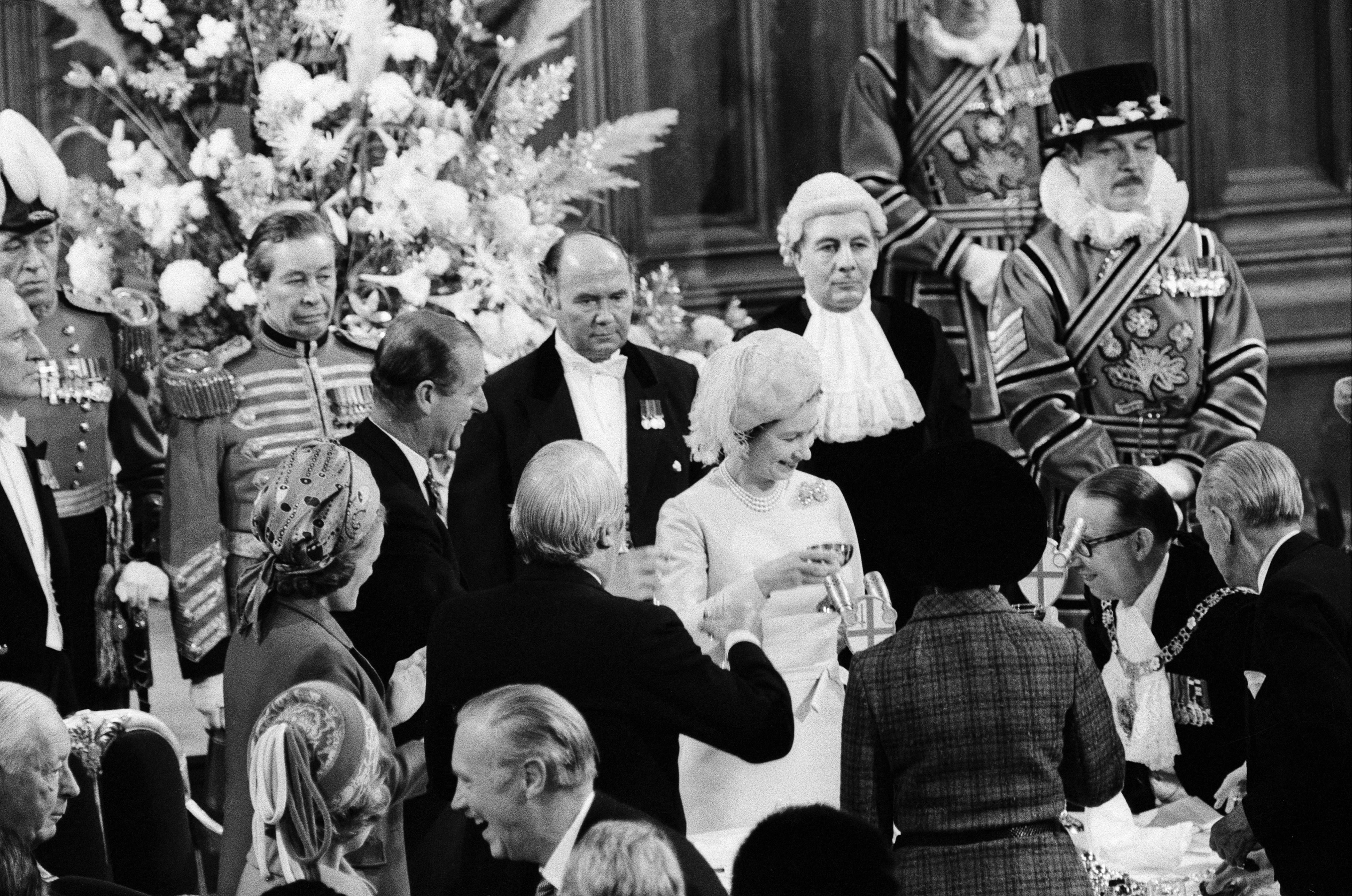 Queen Elizabeth and Philip toasting on their 25th anniversary.