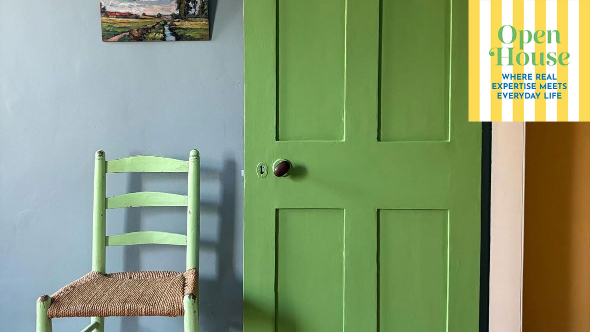 green internal door open onto a blue wall and green chair