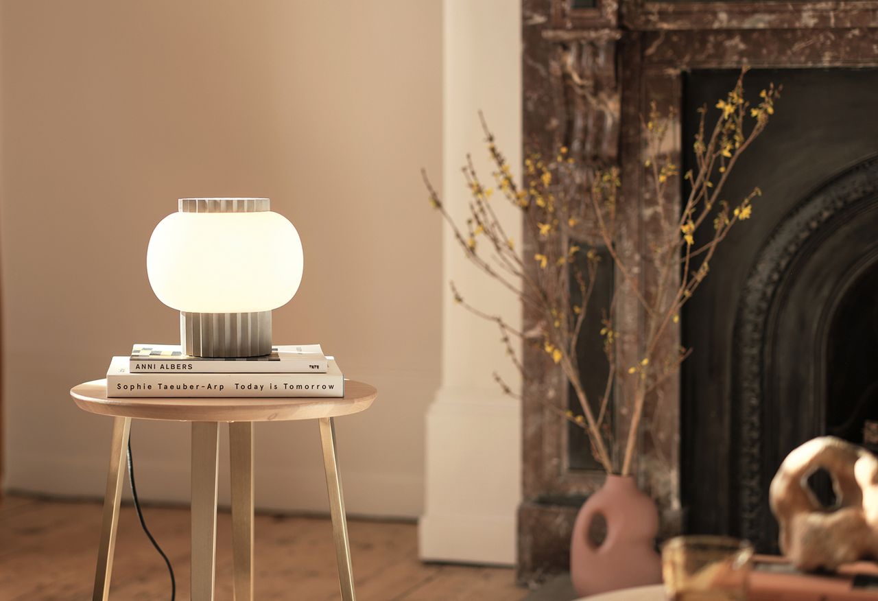 Doric table lamp by Heal&#039;s on a wooden table