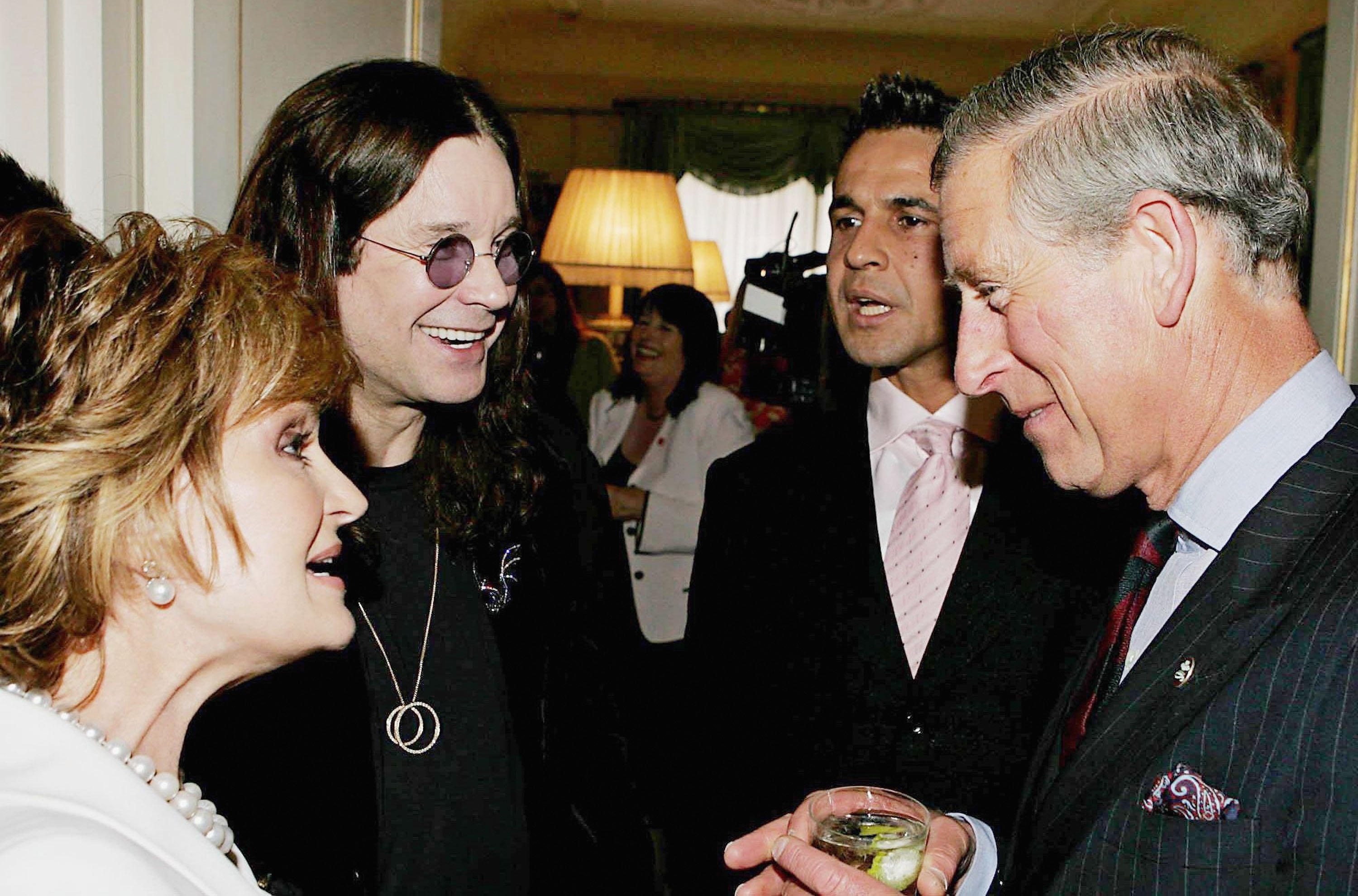 Sharon and Ozzy Osbourne talking to King Charles