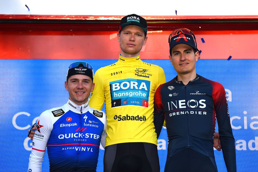 VALENCIA SPAIN FEBRUARY 06 LR Remco Evenepoel of Belgium and Team QuickStep Alpha Vinyl on second place race winner Aleksander Vlasov of Russia and Team Bora Hansgrohe yellow leader jersey and Carlos Rodriguez Cano of Spain and Team INEOS Grenadiers on third place pose on the podium during the podium ceremony after the 73rd Volta A La Comunitat Valenciana 2022 Stage 5 a 92km stage from Paterna to Valencia VCV2022 on February 06 2022 in Valencia Spain Photo by Dario BelingheriGetty Images