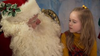 Julianna Layne with a Santa Claus in A Christmas Story Christmas