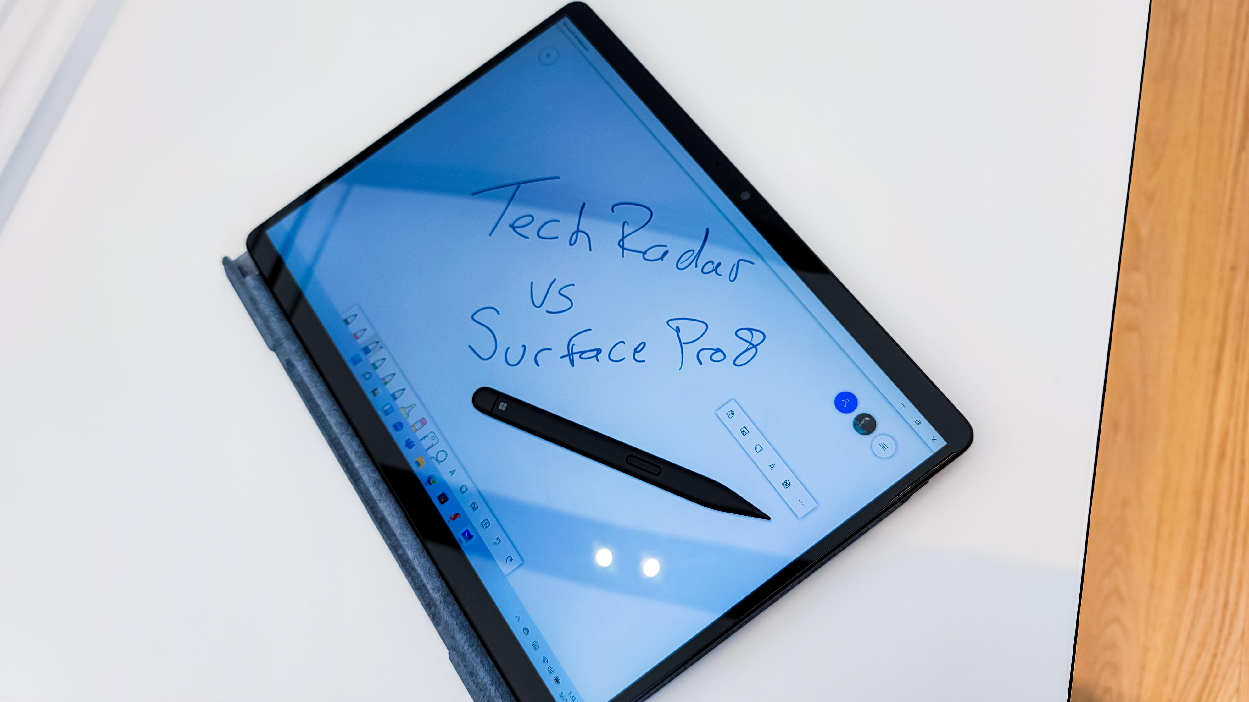 Surface Pro 8 in tablet mode with pen. text on screen says 