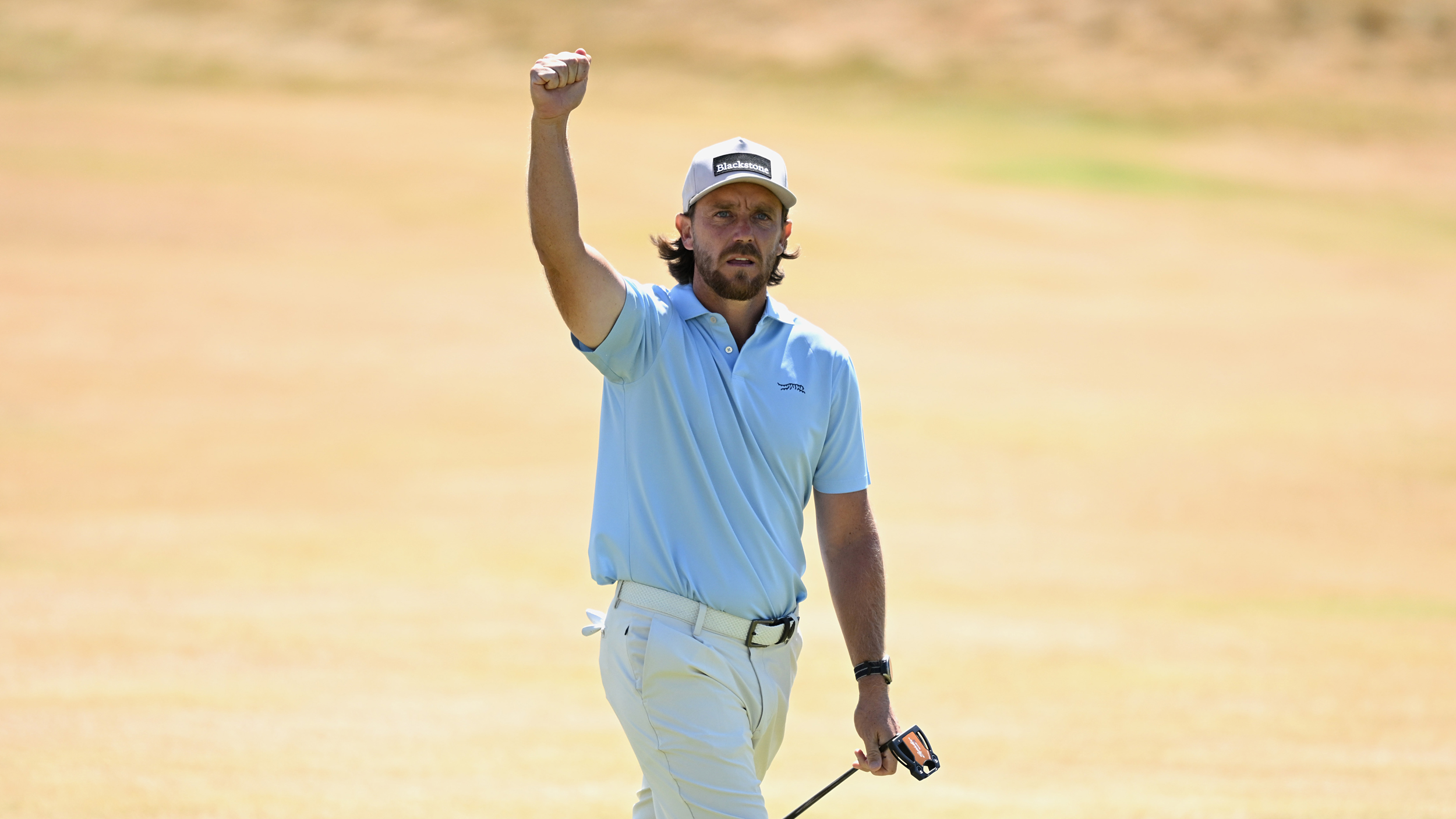 Tommy Fleetwood celebrates holing a putt at The Open