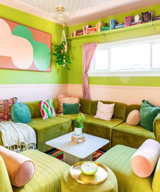 Small living room with lime walls, bright cushions, lime couch, artwork,