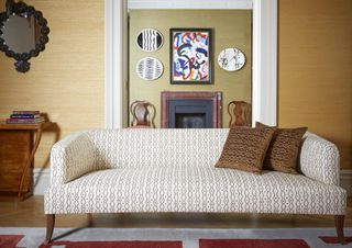 A sofa in front of a doorway