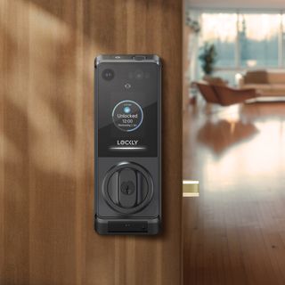 A Lockly Vision Prestige smart lock set in a wooden and glass door