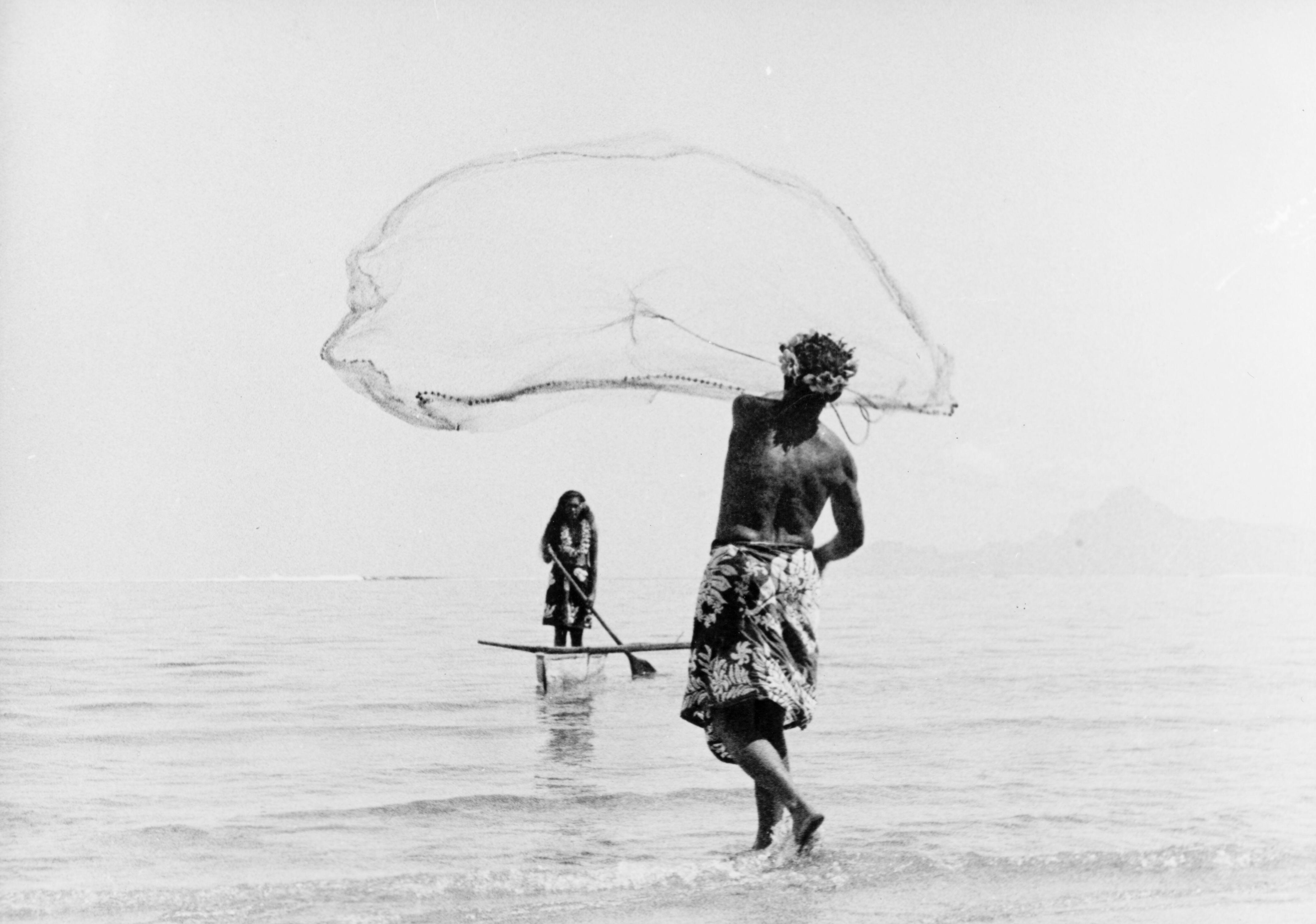 A traditional outrigger canoe used for transport and fishing for centuries, pictured in 1965