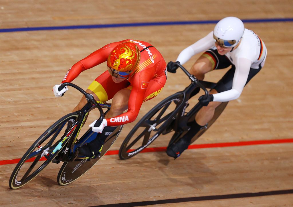 IZU JAPAN AUGUST 07 Tianshi Zhong of Team China sprints ahead of Emma Hinze of Team Germany during the Womens sprint round of 8 finals heat 3 of the track cycling on day filthen of the Tokyo 2020 Olympic Games at Izu Velodrome on August 07 2021 in Izu Shizuoka Japan Photo by Tim de WaeleGetty Images