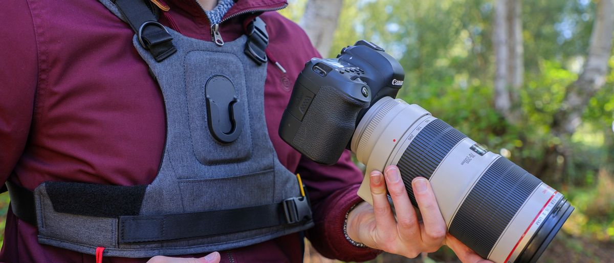 Cotton Carrier G3 worn by a man in a burgandy jacket outdoors in a woods