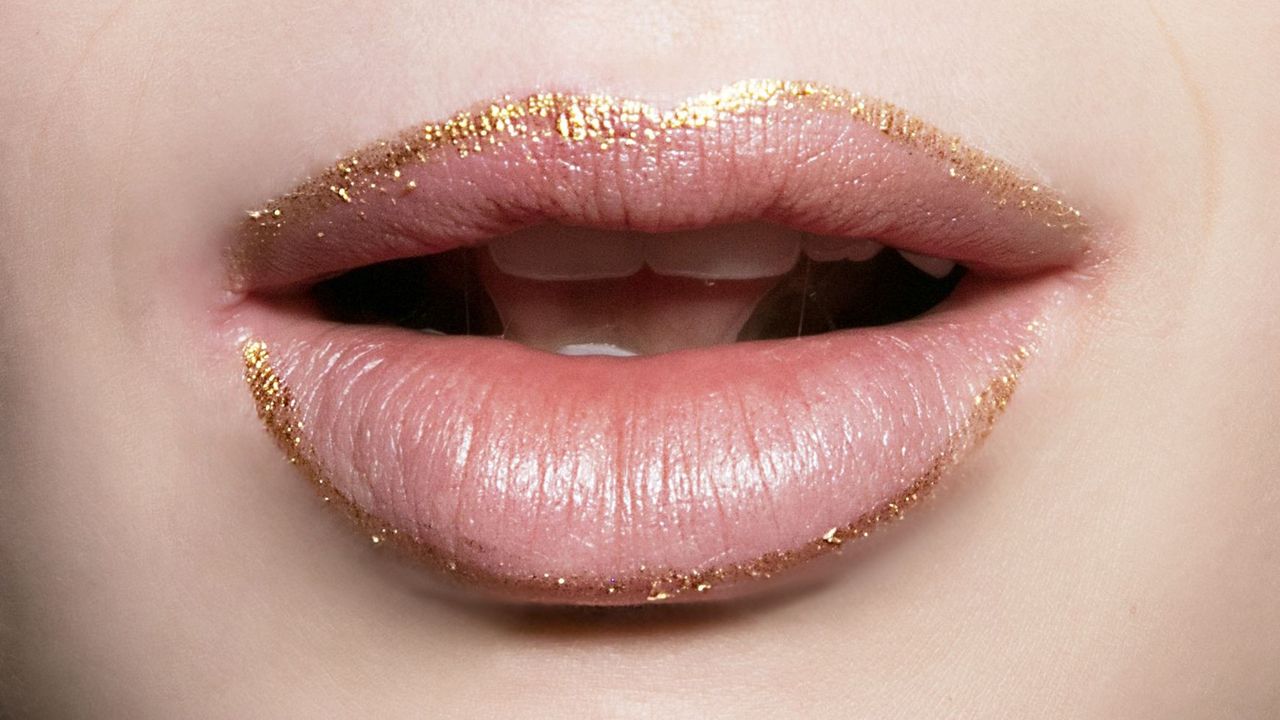 Lips lined with gold lipliner