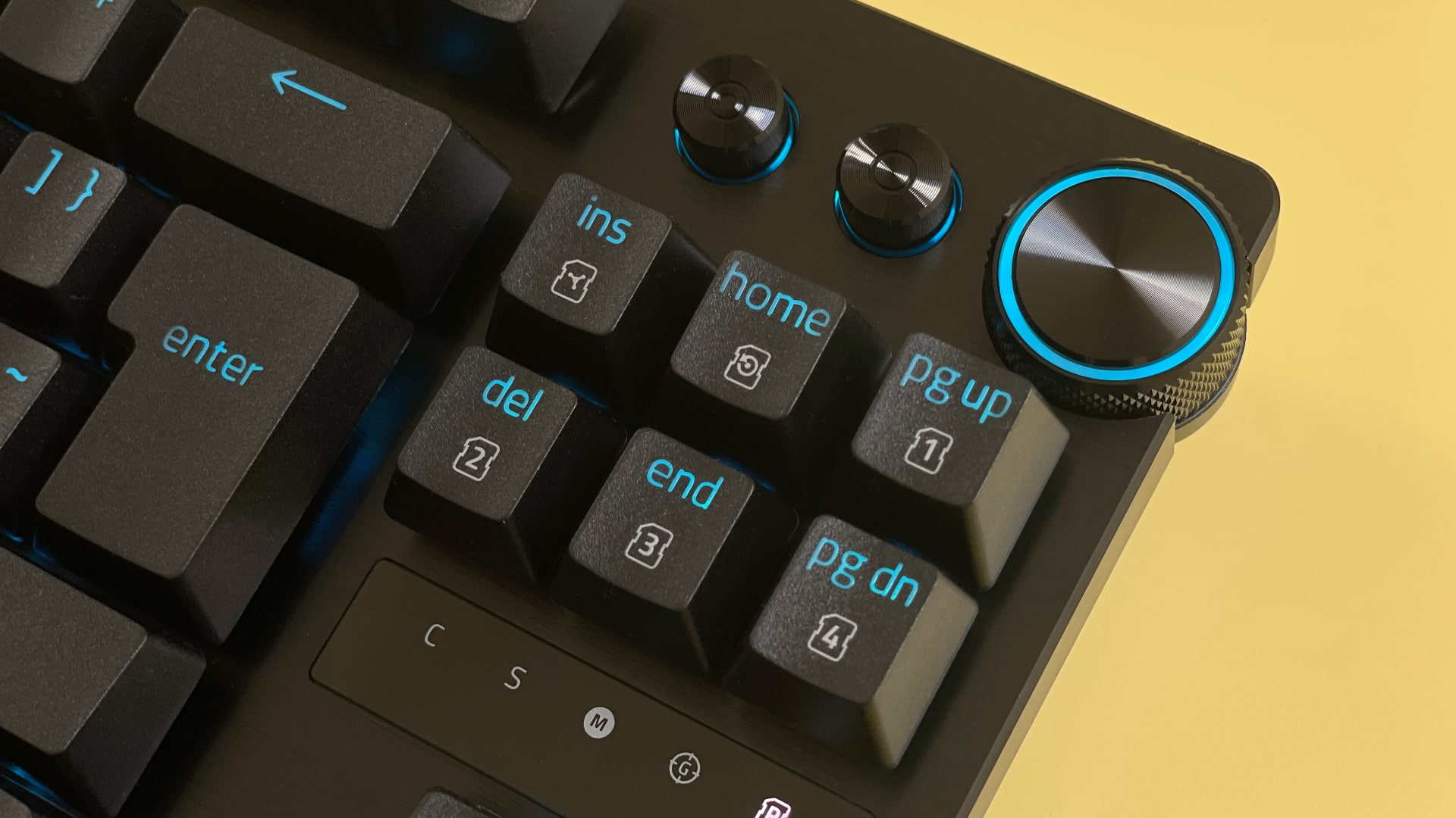 The Razer Huntsman V3 Pro Tenkeyless mechanical gaming keyboard against a yellow background.