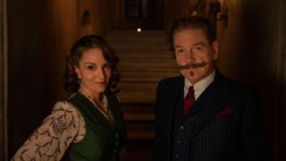 Ariadne and Hercule Poirot look directly into the camera in A Haunting in Venice