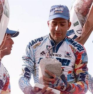 Franco Ballerini savours the moment as he collects the winners trophy in the 1998 Paris-Roubaix