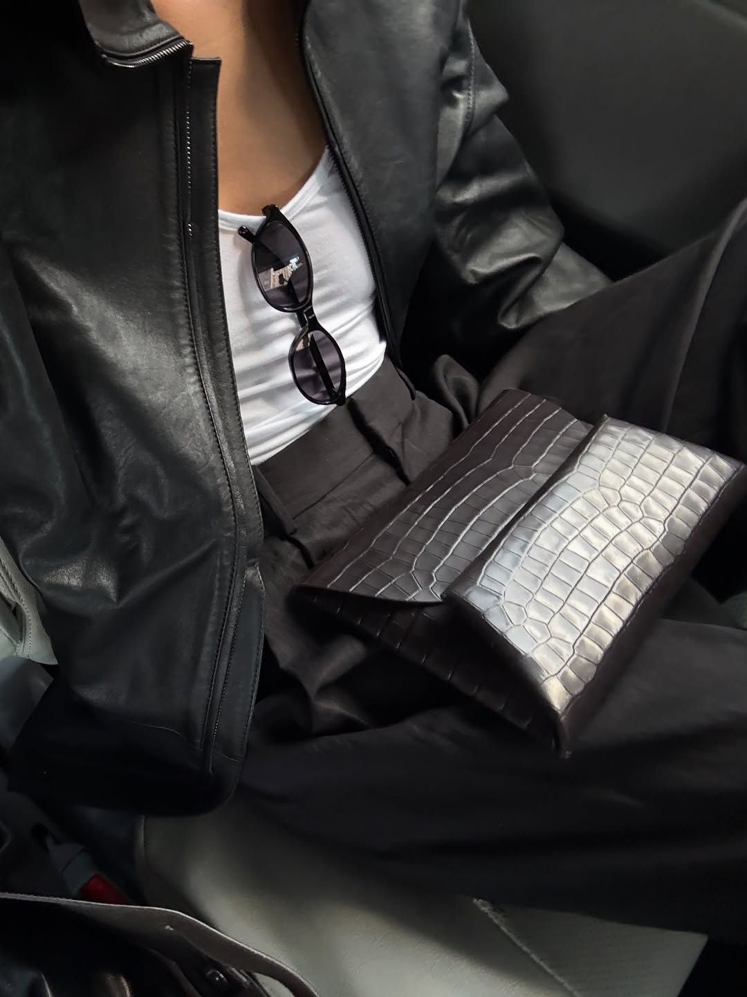 Woman wearing collared leather jacket trend fall 2025.
