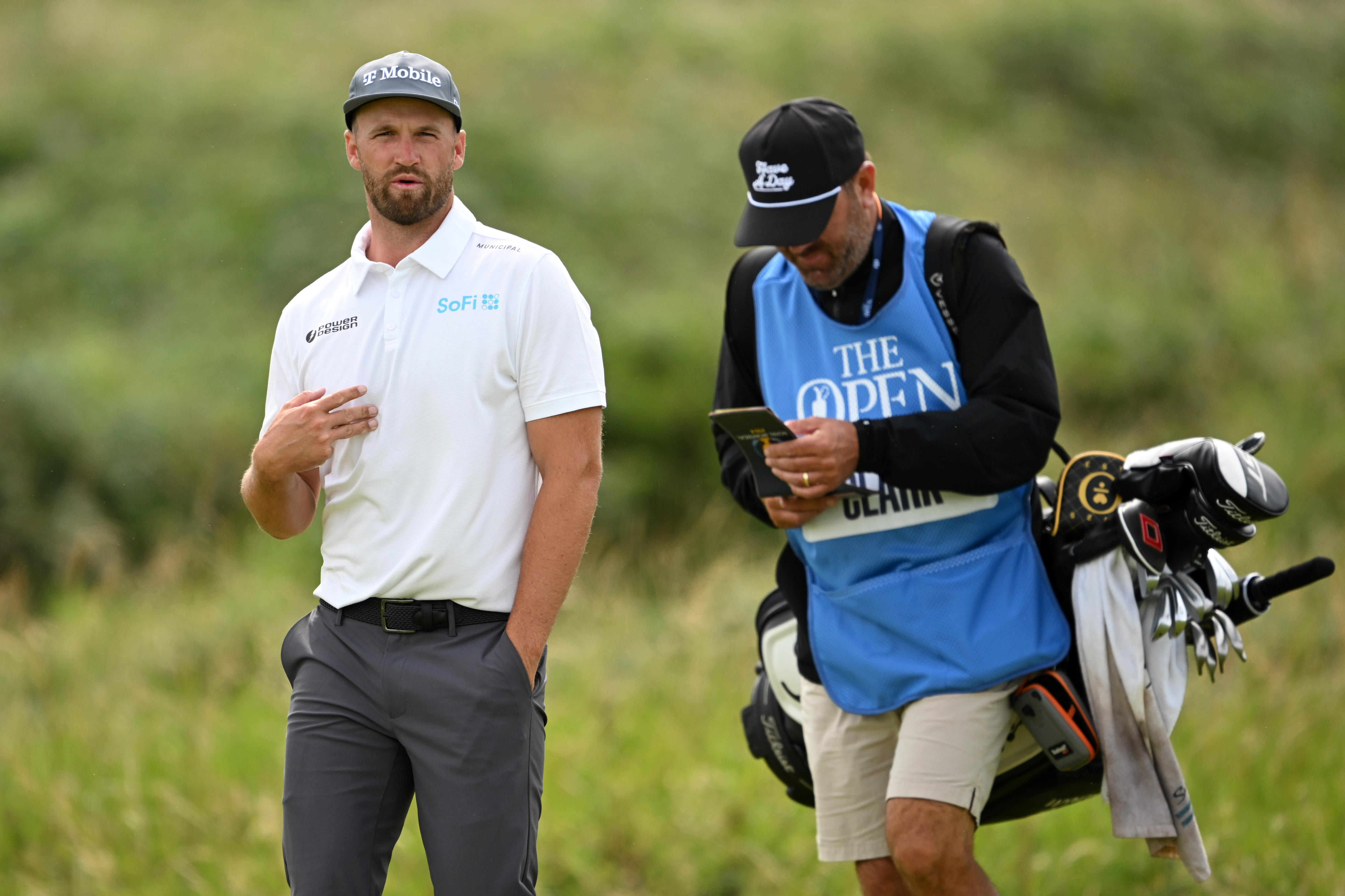 Wyndham Clark chats to his caddie during The Open Championship