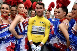Mark Cavendish (Dimension Data) with French can-can dancers