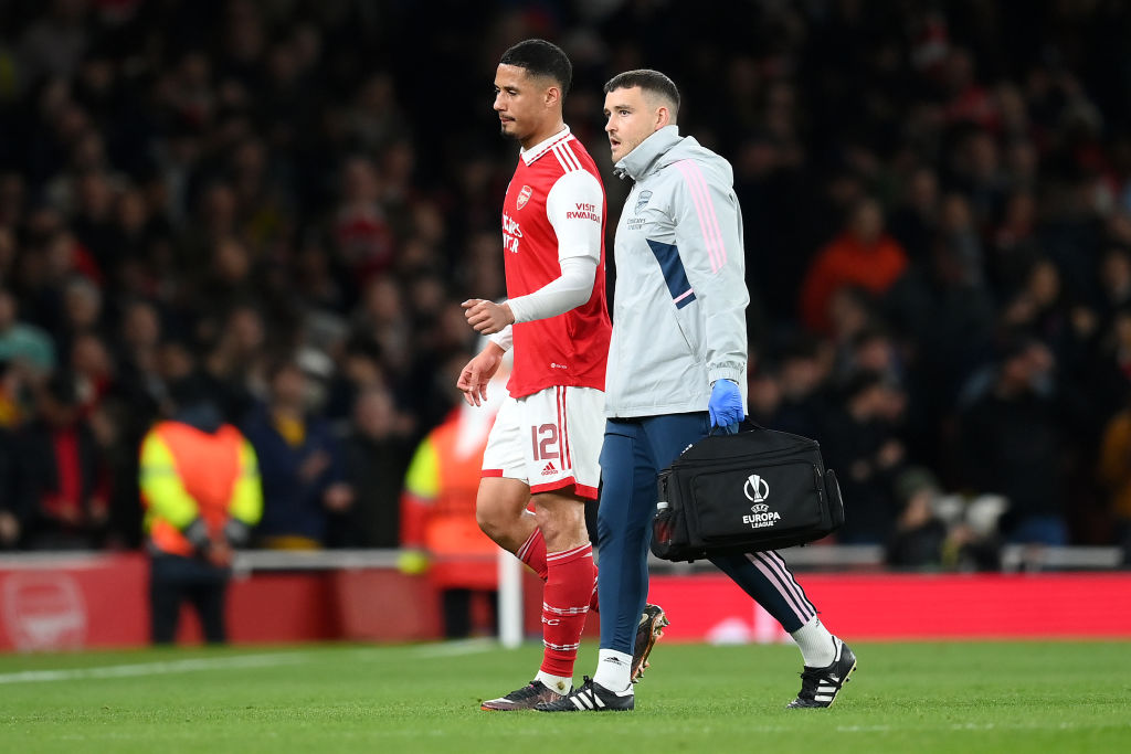 William Saliba of Arsenal leaves the pitch after picking up an injury during the UEFA Europa League round of 16 leg two match between Arsenal FC and Sporting CP at Emirates Stadium on March 16, 2023 in London, England.