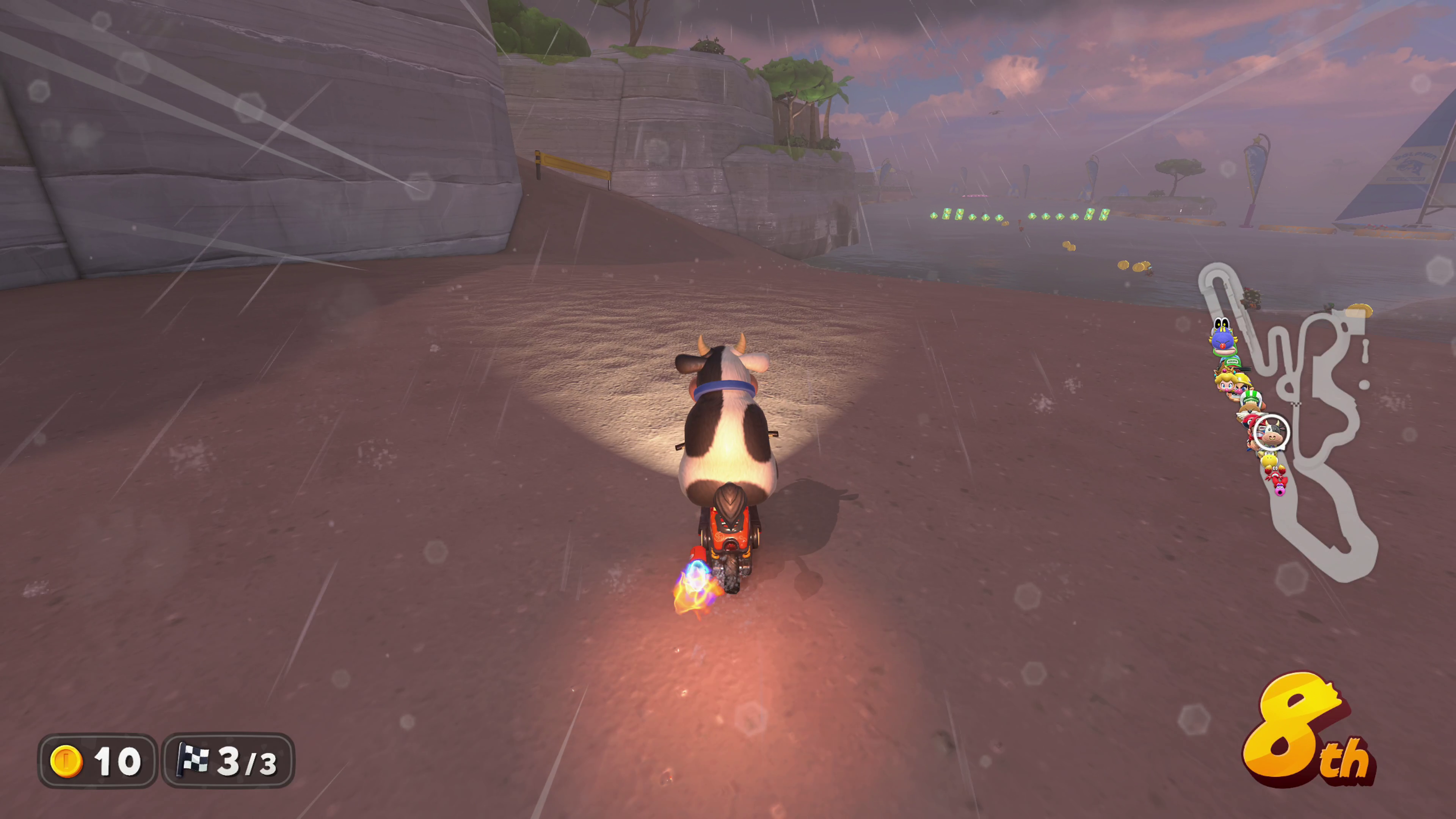 Screenshot from Mario Kart World showing rain effects and boost engine flames