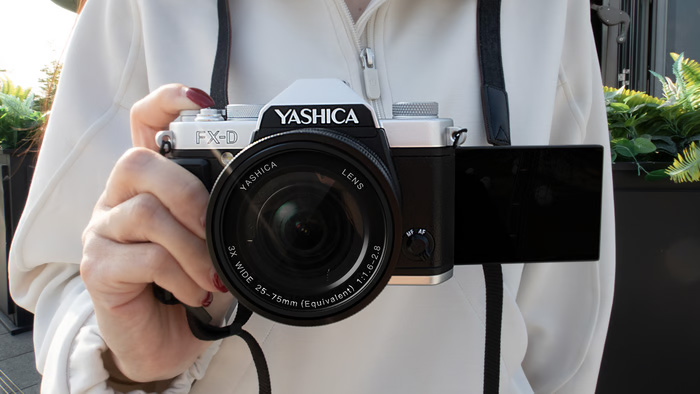 One of the Yashica FX-D cameras with the screen flipped out to the side