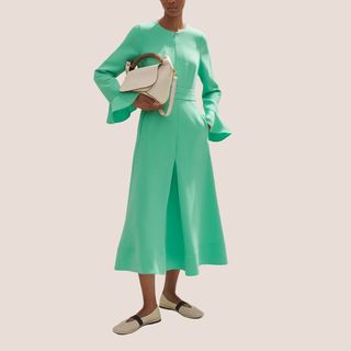 flat lay image of woman wearing green dress