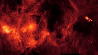 red clouds of gas and dust in deep space