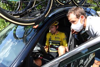 Primoz Roglic got in the JUmbo-Visma team car but then continued in the race
