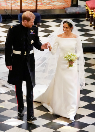 Prince Harry, Duke of Sussex and The Duchess of Sussex depart following their wedding in St George's Chapel at Windsor Castle on May 19, 2018 in Windsor, England