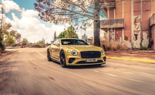 Bentley Continental GT Speed front view driving on a road