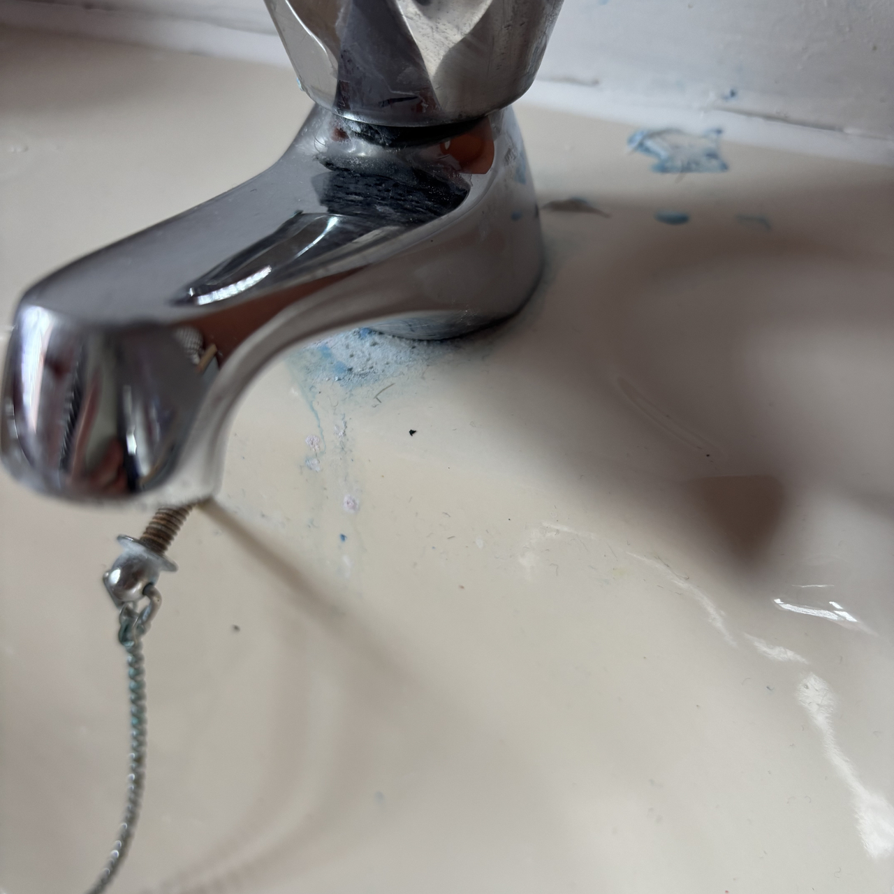 Tap with toothpaste stains